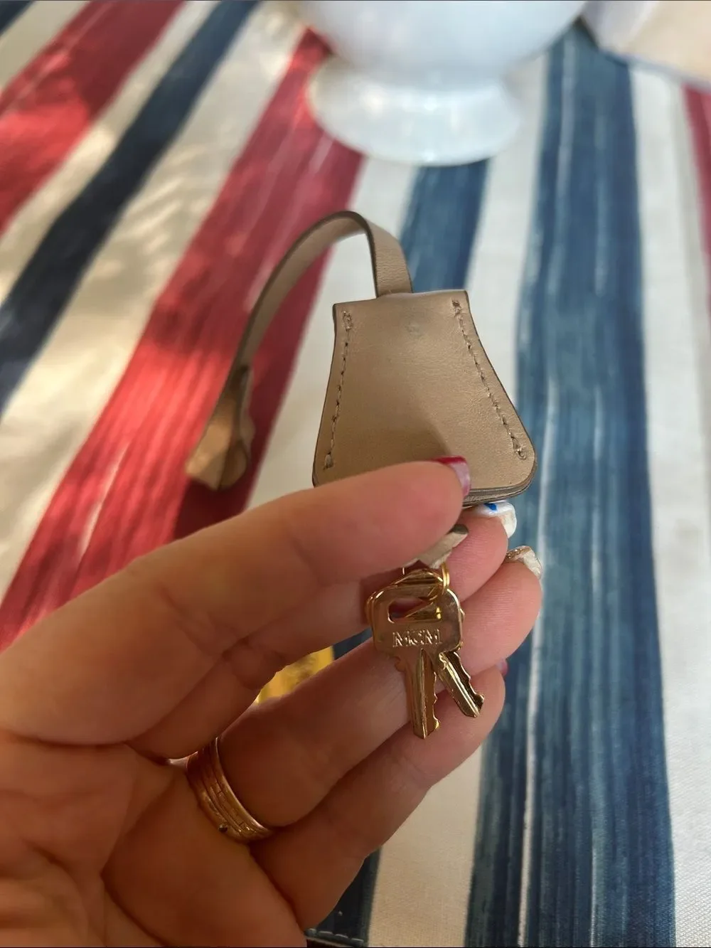 MCM jet and lock gold color with cream lanyard amazing condition